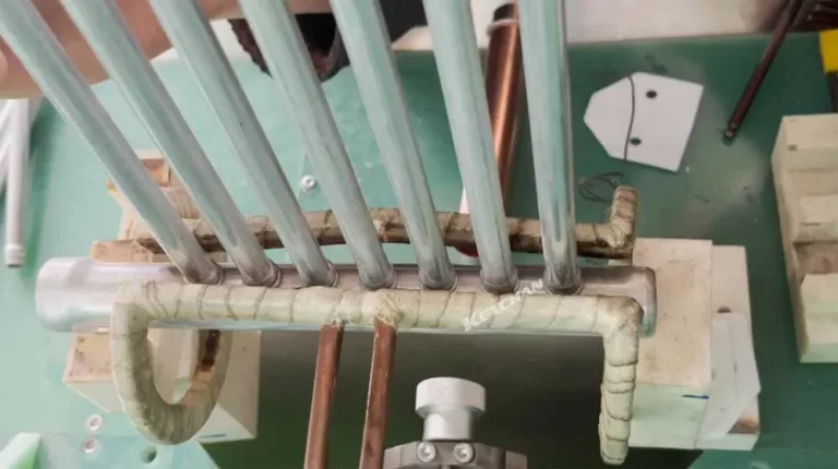 Induction soldering of aluminum water branch manifold