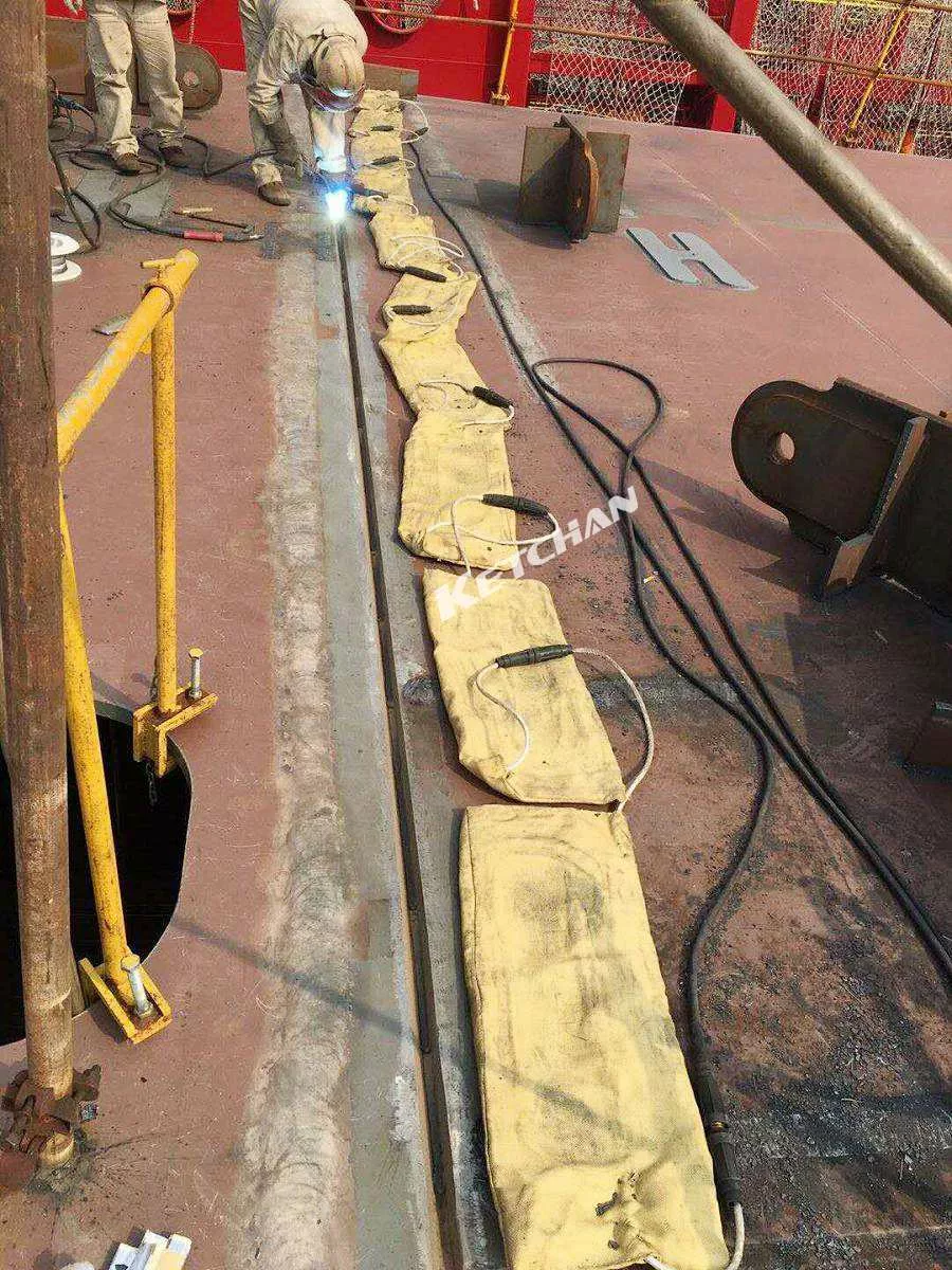 Preheating of steel plate welds in shipbuilding industry